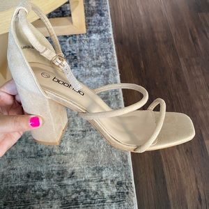 Brand new, never worn, open toe, thicker heel.